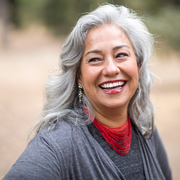 woman with red lipstick smiling