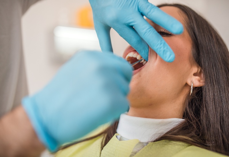 A close-up of a tooth extraction procedure by a dentist on a patient in a clinic in Millersburg, OH